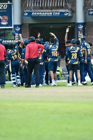 Doiwala Kings players gathering on the field